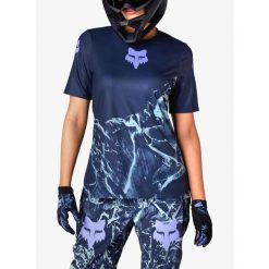 Koszulka rowerowa damska Fox Ranger SS Jersey Img Print. Niebieskie koszulki sportowe damskie FOX, bez wzorów, z jersey, bez kołnierzyka, bez ramiączek, rowerowe. Za 219.99 zł.