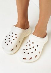 Beżowe Klapki z Wycięciami na Nosku i Paskiem na Piętę Cisatria. Brązowe klapki damskie Born2be, bez wzorów, bez obcasa. Za 59.99 zł.