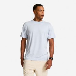 Koszulka fitness męska Domyos. Białe koszulki sportowe męskie DOMYOS, m, bez wzorów, z dzianiny, bez kołnierzyka, bez ramiączek, na fitness i siłownię. Za 69.99 zł.