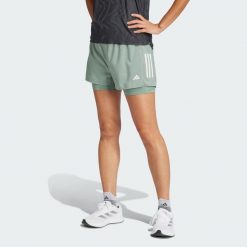 Szorty Own the Run Climacool 2-in-1. Zielone szorty sportowe damskie Adidas, bez wzorów, sportowe, do biegania, climacool (adidas). Za 199.00 zł.