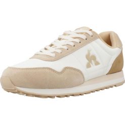 Kapcie LE COQ SPORTIF ASTRA_2 Jasnobrązowy. Białe kapcie damskie le coq sportif, bez wzorów, z materiału. Za 330.00 zł.
