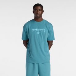 Koszulka męska New Balance MT61D0U5AAZ – niebieska. Niebieskie koszulki sportowe męskie New Balance, m, z aplikacjami, z dresówki, bez kołnierzyka, bez ramiączek. Za 139.99 zł.