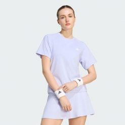 KOSZULKA CLUB TENNIS CLIMACOOL. Fioletowe koszulki sportowe damskie Adidas, uniwersalny, bez wzorów, z elastanu, bez kołnierzyka, bez ramiączek, na fitness i siłownię, climacool (adidas). Za 179.00 zł.