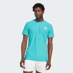 Koszulka Tennis Climacool+ AIRCHILL FreeLift. Niebieskie koszulki sportowe męskie Adidas, bez wzorów, bez kołnierzyka, bez ramiączek, tenisowe, climacool (adidas). W wyprzedaży za 206.15 zł.