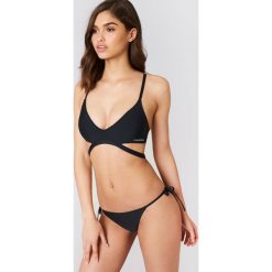 Calvin Klein Dół bikini z wiązaniem z boku Cheeky - Black. Bikini damskie marki Calvin Klein. W wyprzedaży za 101.47 zł.