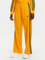 Adidas Spodnie dresowe adicolor Classic Firebird JP2316 Żółty Loose Fit. Żółte spodnie dresowe damskie Adidas, s, bez wzorów, z dresówki. Za 199.99 zł.