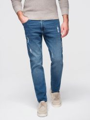 Męskie spodnie jeansowe SLIM FIT z przetarciami - ciemnoniebieskie V2. Niebieskie spodnie materiałowe męskie Ombre Clothing, m, z aplikacjami, z bawełny, biznesowe. Za 239.99 zł.