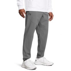 Under Armour VIBE WOVEN JOGGER Spodnie męskie. Szare spodnie sportowe męskie Under Armour, l, bez wzorów, z materiału, na fitness i siłownię. Za 209.99 zł.