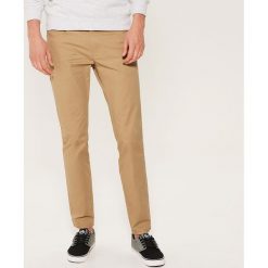 Materiałowe spodnie slim fit - Beżowy. Brązowe spodnie materiałowe męskie House, z materiału. Za 89.99 zł.
