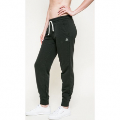 Reebok - Spodnie. Szare spodnie sportowe damskie Reebok, z bawełny. W wyprzedaży za 129.90 zł.