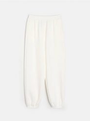 Spodnie dresowe jogger scuba z domieszką wiskozy - kremowy. Białe spodnie dresowe damskie Sinsay, l, bez wzorów, z dresówki. Za 39.99 zł.