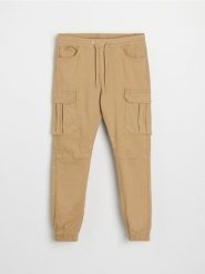 Jeansy regular jogger cargo - żółty. Żółte jeansy męskie Sinsay. Za 99.99 zł.