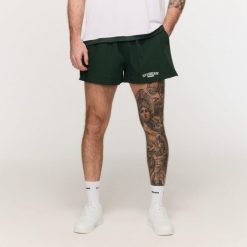 Szorty męskie fitness oversize zielone Varsity. Zielone krótkie spodenki sportowe męskie GYMBEAM, l, bez wzorów, z bawełny, na fitness i siłownię. Za 88.90 zł.