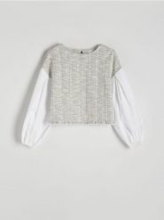 Bluzka z kontrastowymi rękawami - wielobarwny. Bluzki damskie Reserved, l, bez wzorów, z materiału, bez kołnierzyka, bez ramiączek. W wyprzedaży za 39.99 zł.