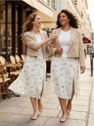 Wiskozowa spódnica midi z asymetrycznym dołem w kwiaty - wielobarwny. Spódnice damskie Sinsay, l, bez wzorów, z wiskozy, midi, asymetryczne. Za 49.99 zł.