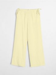 Muślinowe spodnie wide leg - żółty. Żółte spodnie materiałowe damskie Sinsay, l, bez wzorów. Za 49.99 zł.