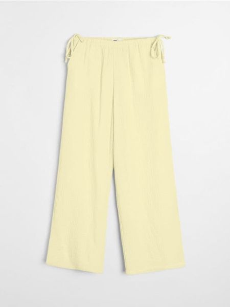 Muślinowe spodnie wide leg - żółty. Żółte spodnie materiałowe damskie Sinsay, l, bez wzorów. Za 49.99 zł.