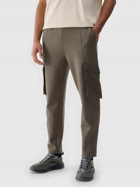 SPODNIE MĘSKIE 4F CASUAL CARGO S TTROM0990. Brązowe spodnie sportowe męskie 4f, l, bez wzorów, trekkingowe. Za 169.99 zł.