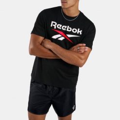 Koszulka fitness męska Reebok. Koszulki sportowe męskie Reebok, m, bez wzorów, z bawełny, bez kołnierzyka, bez ramiączek, na fitness i siłownię. Za 99.99 zł.