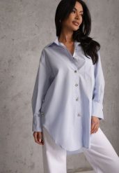 Niebieska Oversizowa Koszula z Bawełny z Eleganckimi Guzikami Rhenenore. Niebieskie bluzki damskie Renee, l, bez wzorów, z bawełny, eleganckie, bez kołnierzyka, bez ramiączek. Za 169.99 zł.