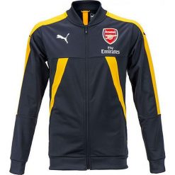 Kurtka "FC Arsenal" w kolorze granatowo-żółtym. Niebieskie kurtki męskie marki Puma, bez wzorów, z materiału, sportowe. W wyprzedaży za 128.95 zł.