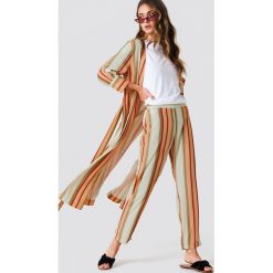Trendyol Spodnie w paski - Multicolor. Szare spodnie materiałowe damskie marki Trendyol, w paski. W wyprzedaży za 56.78 zł.