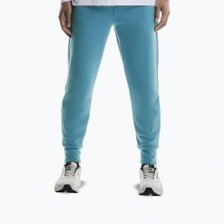 Spodnie treningowe męskie On Focus Tech. Niebieskie spodnie sportowe męskie On, m, bez wzorów, z elastanu, do biegania. Za 459.99 zł.