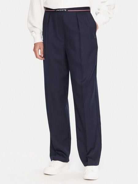 Lacoste Spodnie materiałowe HF5307 Granatowy Relaxed Fit. Niebieskie spodnie materiałowe damskie Lacoste, bez wzorów, z materiału. Za 999.99 zł.