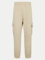 Champion Spodnie dresowe 117554 Beżowy Loose Fit. Brązowe spodnie dresowe damskie Champion, xl, bez wzorów, z dresówki. Za 129.99 zł.