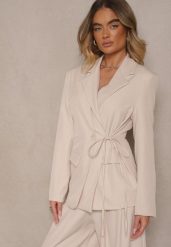 Jasnobeżowa Marynarka Ozdobiona Wiązaniem z Boku Lunorisa. Brązowe żakiety damskie Renee, l, bez wzorów, eleganckie. Za 119.99 zł.
