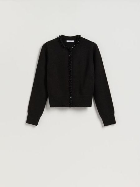 Kardigan z ozdobnym wykończeniem - czarny. Czarne kardigany damskie Reserved, l, bez wzorów, z dzianiny. Za 139.99 zł.