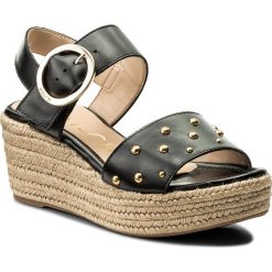 Espadryle UNISA - Kaba Ne Black. Czarne klapki damskie Unisa, bez wzorów, ze skóry ekologicznej, bez obcasa, na obcasie, bez zapięcia. W wyprzedaży za 289.00 zł.