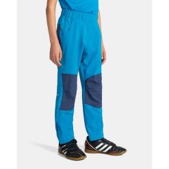 Dziecięce spodnie outdoorowe Kilpi KARIDO-JB. Niebieskie spodnie sportowe dla chłopców Kilpi, bez wzorów, z materiału, sportowe, trekkingowe. Za 145.00 zł.