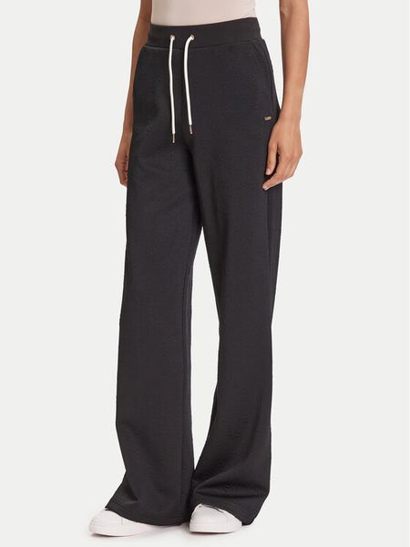 Guess Spodnie dresowe V5YB19 KBSL2 Czarny Regular Fit. Czarne spodnie dresowe damskie Guess, xs, z aplikacjami, z dresówki. Za 259.99 zł.