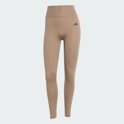 Legginsy Optimé Essentials No Front Rise Seam 7/8. Brązowe legginsy sportowe damskie Adidas, s, bez wzorów, z elastanu, na fitness i siłownię, climacool (adidas). Za 219.00 zł.