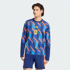 Ciepła rozgrzewkowa bluza podstawowa Hiszpania 26. Niebieskie bluzy męskie Adidas, l, bez wzorów, z dzianiny, bez kaptura. Za 349.00 zł.