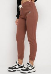 Brązowe Spodnie Dresowe Zwężane z Kieszeniami i Gumką w Pasie Lerikas. Brązowe spodnie dresowe damskie Born2be, l, bez wzorów, z dresówki. Za 44.99 zł.