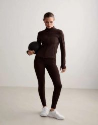 Damskie legginsy wysoki stan, odprowadzające pot, squat proof Sense Tall brązowe. Brązowe legginsy damskie Aim'n, s, bez wzorów, z elastanu. Za 301.00 zł.