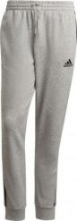 Adidas Szare spodnie dresowe Adidas Essentials Tap Cuff 3 Stripes GK8889 S. Szare spodnie sportowe męskie Adidas, m, bez wzorów, z dresówki. Za 182.12 zł.