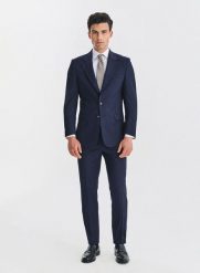 PAKO LORENTE - Wełniany granatowy garnitur męski. Niebieskie spodnie materiałowe męskie Pako Lorente, m, bez wzorów, z wełny, biznesowe. Za 2,499.98 zł.