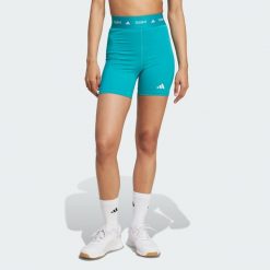 Krótkie legginsy TECHFIT. Niebieskie legginsy damskie Adidas, bez wzorów, z materiału. Za 129.00 zł.