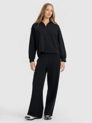 4F Spodnie dresowe z szerokimi nogawkami z modalem damskie - czarne XL. Czarne spodnie dresowe damskie 4f, xl, bez wzorów, z dresówki. Za 189.99 zł.