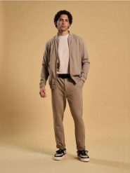 Spodnie slim - beżowy. Brązowe spodnie materiałowe męskie Sinsay, l, bez wzorów. Za 69.99 zł.