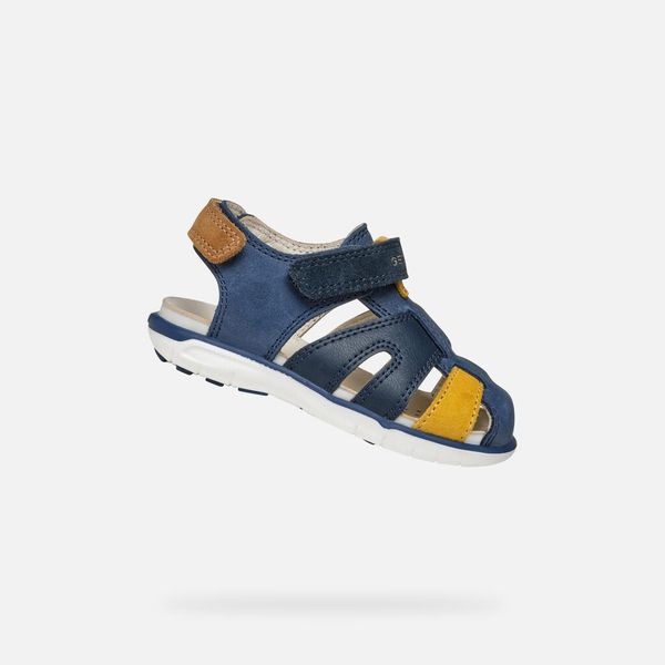 Sandały GEOX B SANDAL DELHI BOY Niebieski. Niebieskie sandały męskie Geox, z syntetyku, bez zapięcia. Za 229.99 zł.
