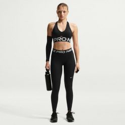 Spodnie fitness damskie Nike Pro. Czarne spodnie sportowe damskie Nike, m, bez wzorów, z materiału, na fitness i siłownię. Za 248.00 zł.