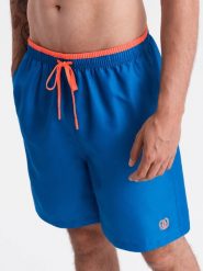 Spodenki męskie kąpielówki z dwukolorowym ściągaczem – ciemnoniebieskie V5. Niebieskie kąpielówki męskie Ombre Clothing, l, bez wzorów, z poliesteru, do pływania. W wyprzedaży za 69.99 zł.