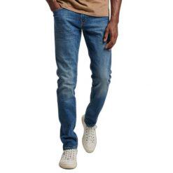Dżinsy slim fit z bawełny organicznej Superdry. Niebieskie jeansy męskie Superdry. W wyprzedaży za 363.85 zł.