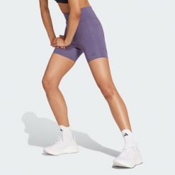 Legginsy Own the Run Short. Fioletowe legginsy damskie Adidas, bez wzorów, z materiału. W wyprzedaży za 170.82 zł.
