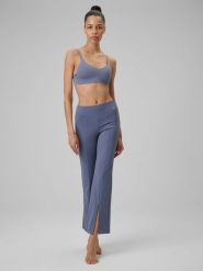 4F Spodnie do jogi z rozszerzanymi nogawkami damskie - niebieskie L. Niebieskie spodnie sportowe damskie 4f, l, bez wzorów, ze skóry, na jogę i pilates. Za 169.99 zł.
