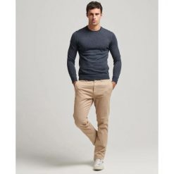 Sweter z wełny merynosów Superdry. Niebieskie swetry przez głowę męskie Superdry., l, bez wzorów, prążkowane, bez kołnierzyka. Za 339.85 zł.